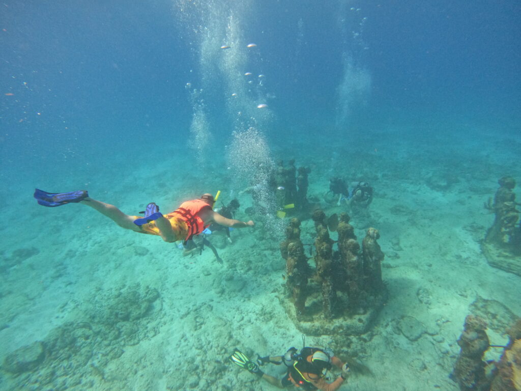 Snorkeling to an underwater museum off of Isla Mujeres