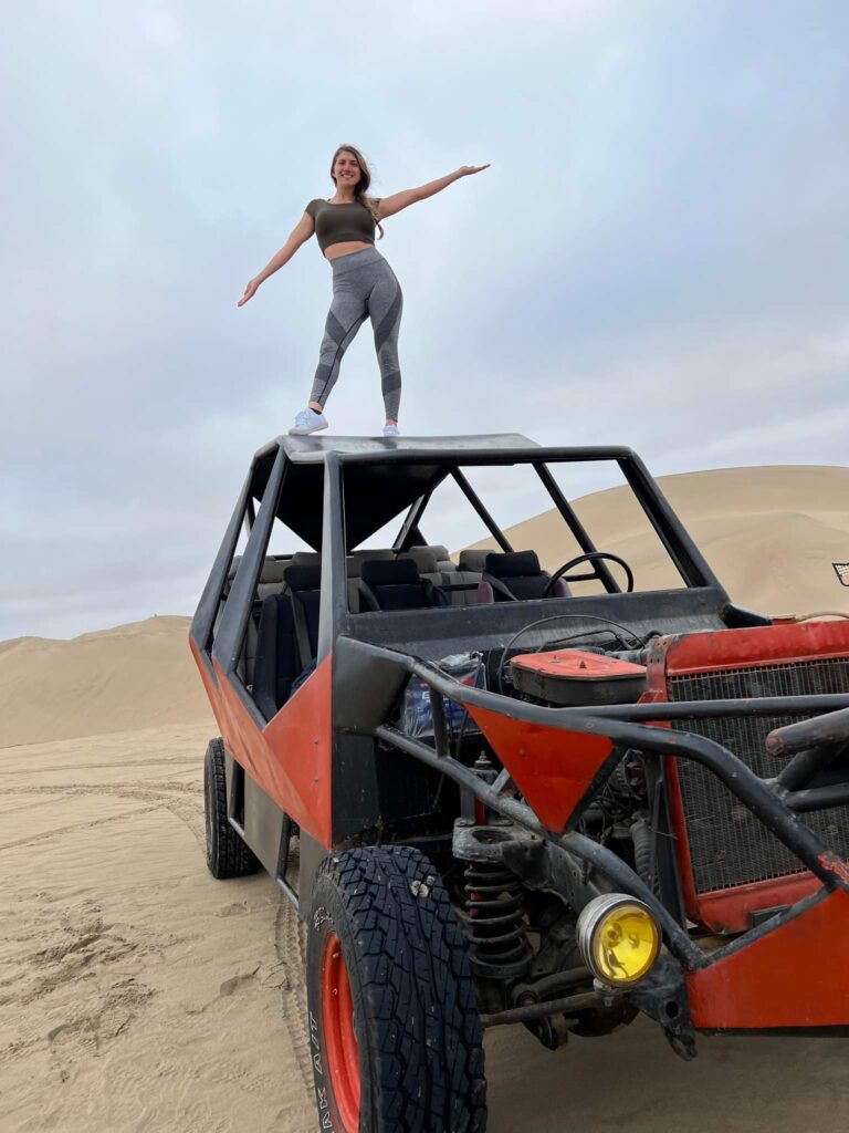 Standing on top of the dune buggy at the Huacachina Oasis