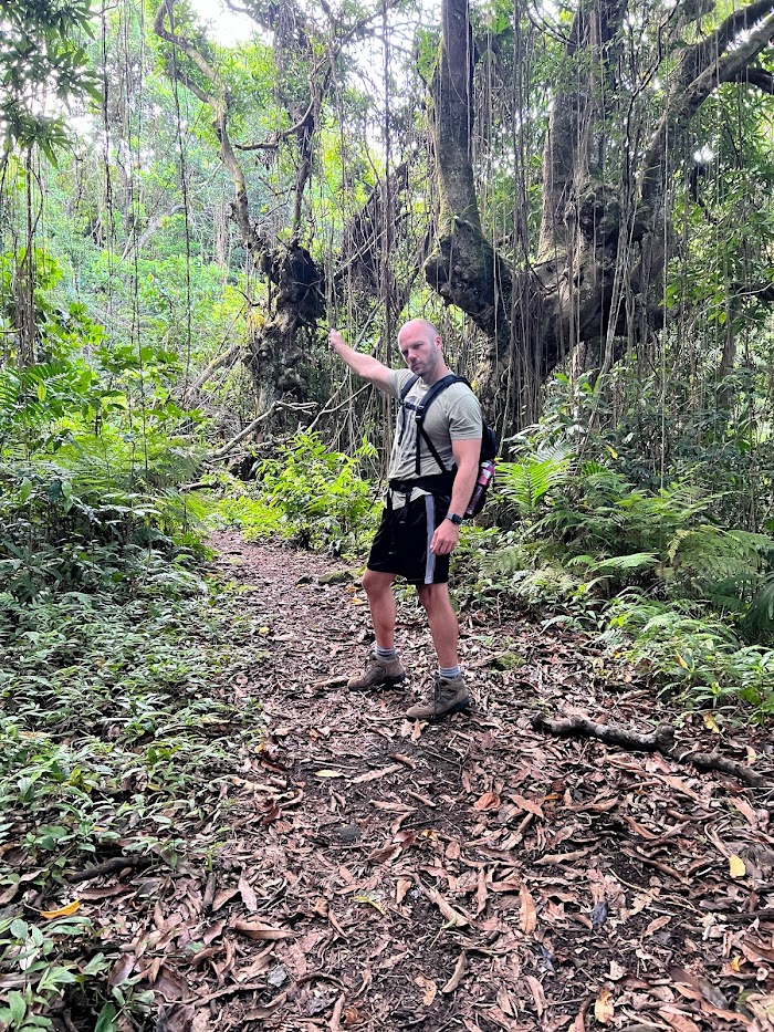 Husband playing on the hike up the volcano on St. Kitts