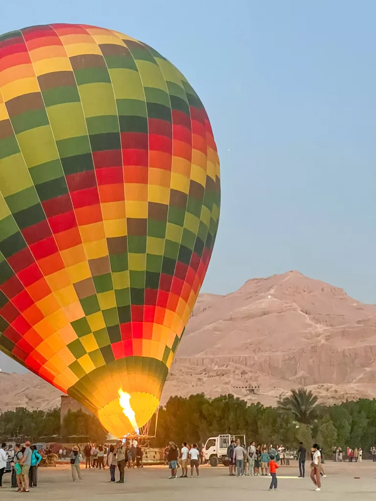 Hot Air balloon blowing up with the desert in the background