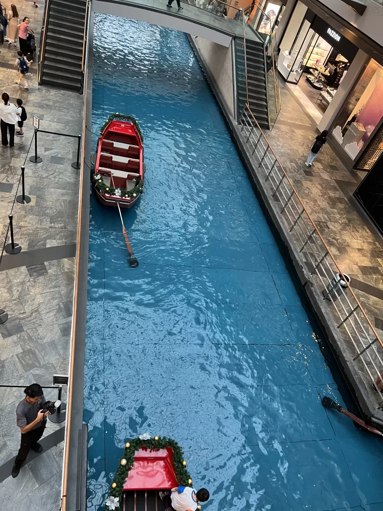 Canal with Sampan boats inside Marina Bay Sands Shopping Mall