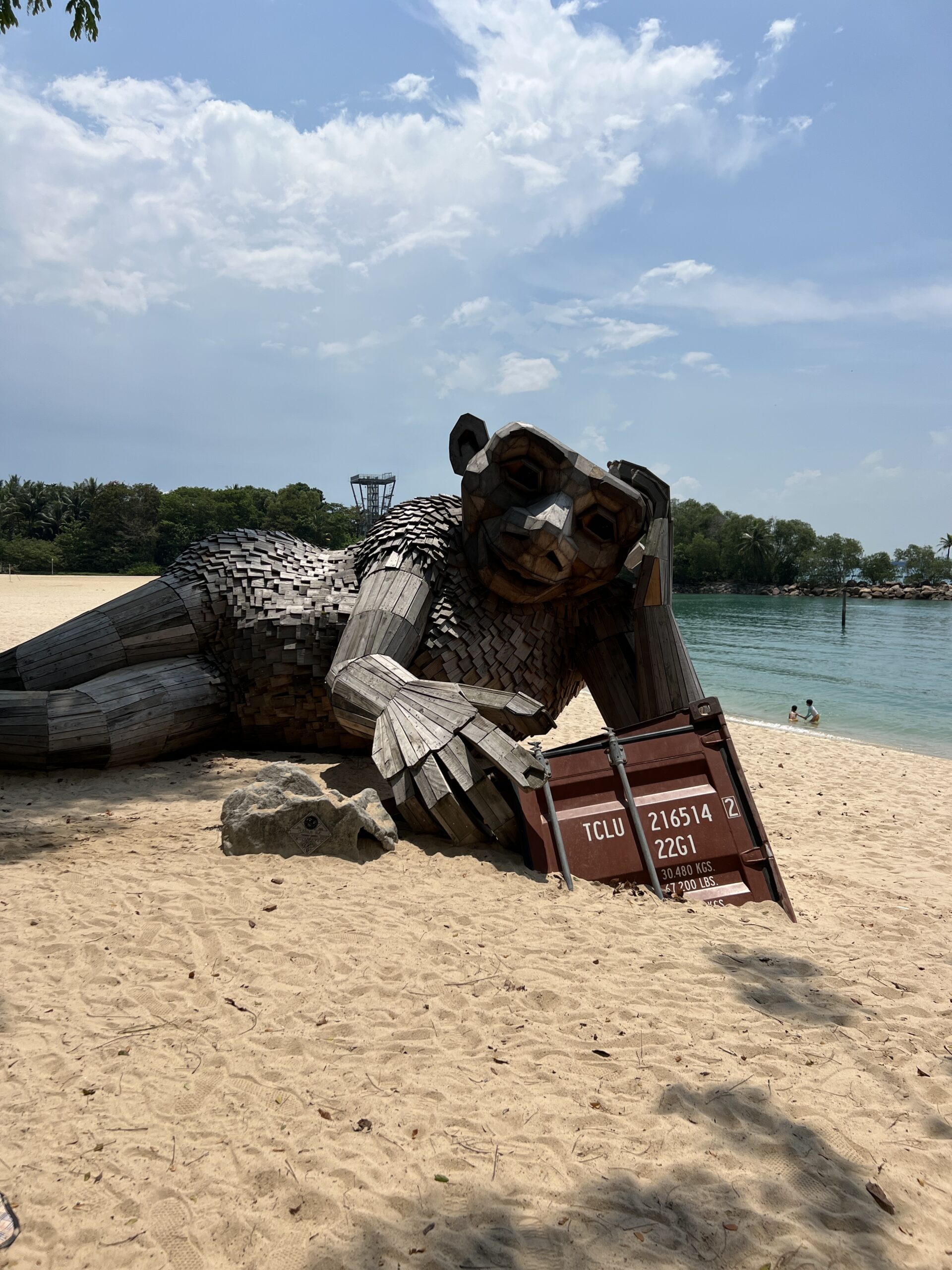 Large Statue of a Monkey lying on the beach in Sentosa, Singapore