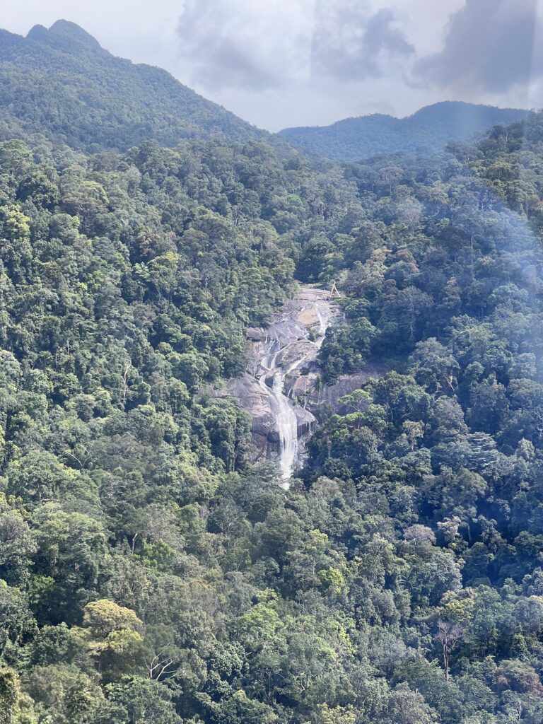View of Seven Wells waterfall from far away on the SkyCab. 
