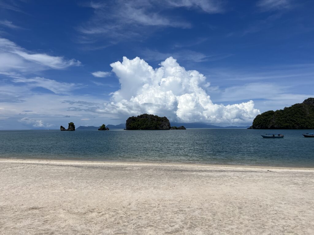 Beautiful beach view with fun rocks and boats